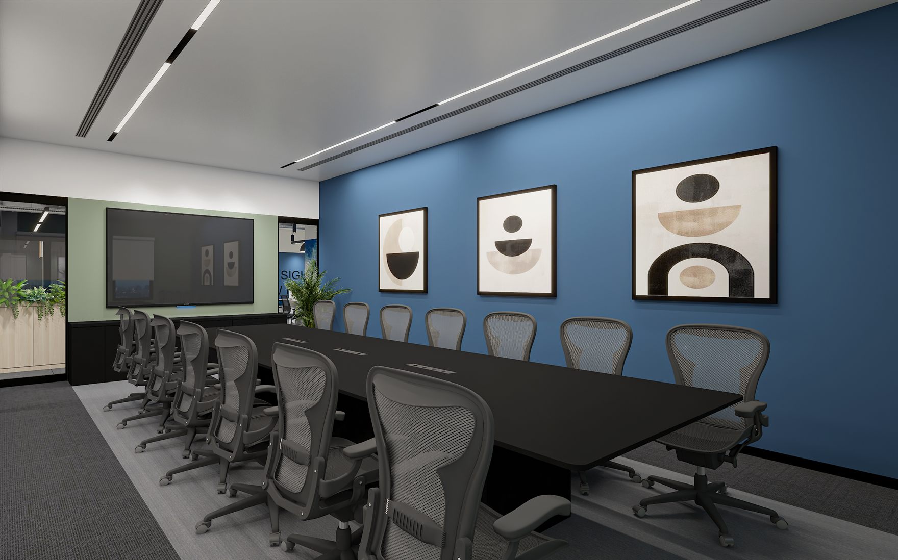 Boardroom with a long black table, grey mesh chairs, a blue accent wall hung with three abstract half-circle artworks and a wall screen on a green panel