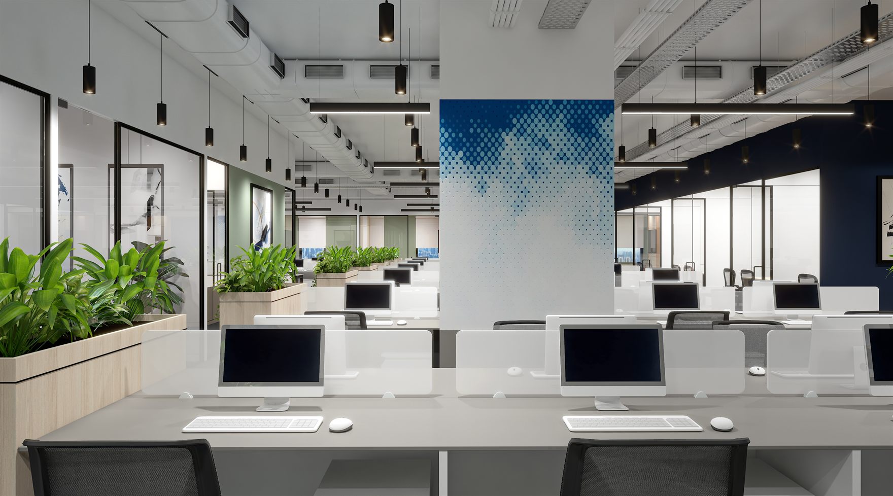 Open workstations with white desks and monitors flanking a blue halftone-graphic column, timber planters of leafy greenery and black cylindrical pendants overhead