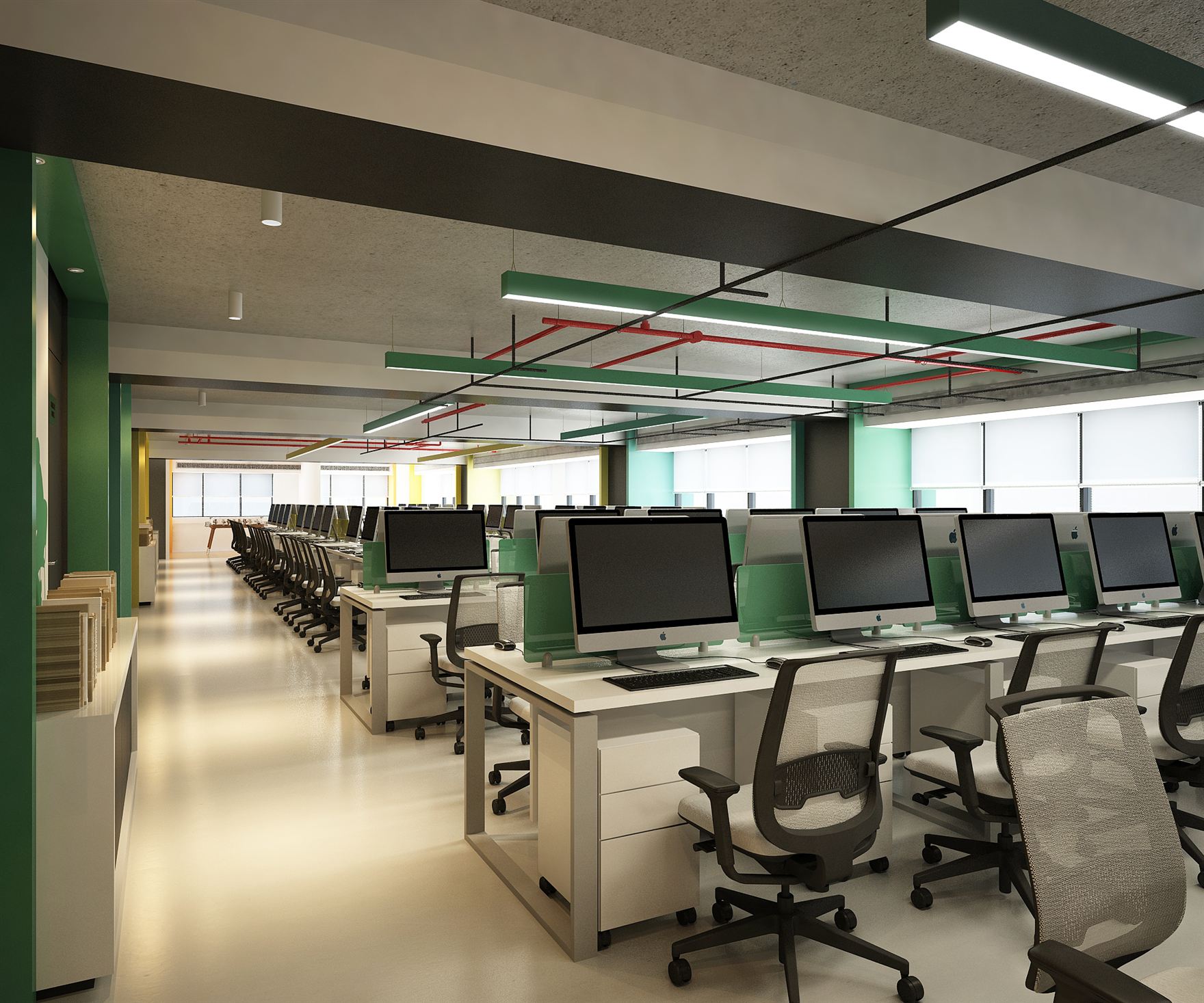 Long open-plan workstation bay with rows of iMac desks, mesh task chairs, and suspended green light troughs beneath an exposed services ceiling.