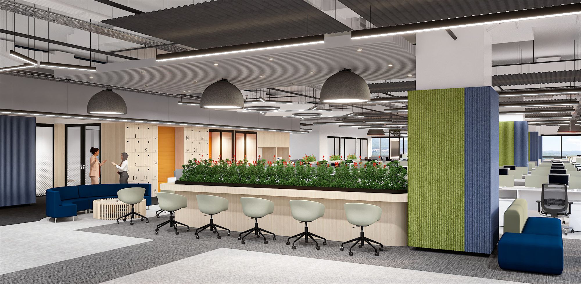 Open workstations with a teal focus booth and green planter screens dividing the floor.