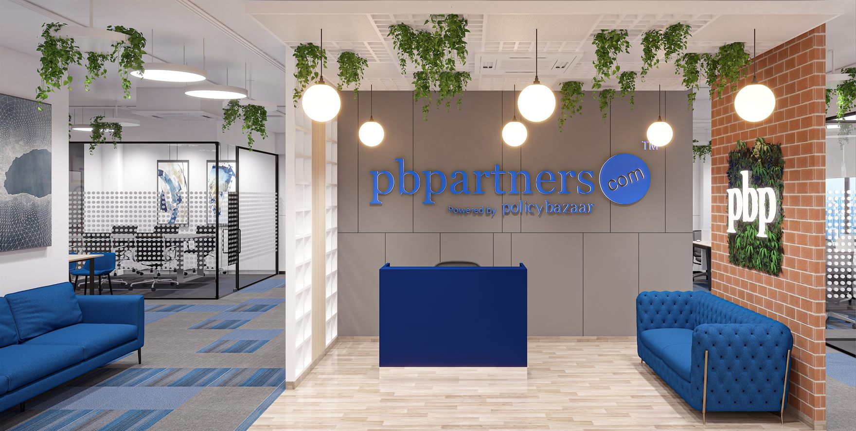 PB Partners reception with the blue pbpartners.com logo on a grey wall, exposed brick with a moss pbp sign, blue sofas and trailing ceiling plants