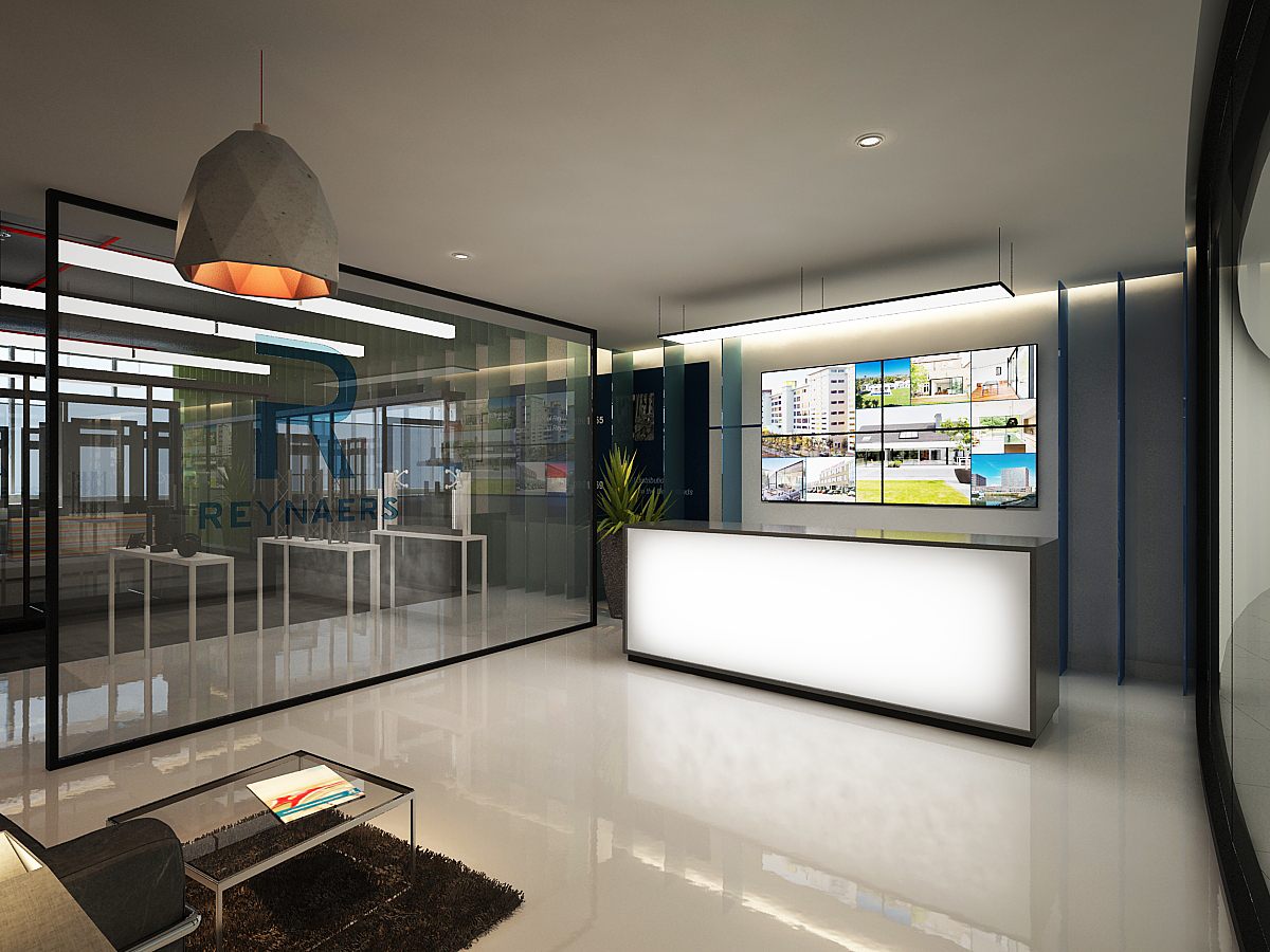 Reception with backlit desk, concrete pendant, project video-wall and the etched Reynaers R logo on the glass partition.