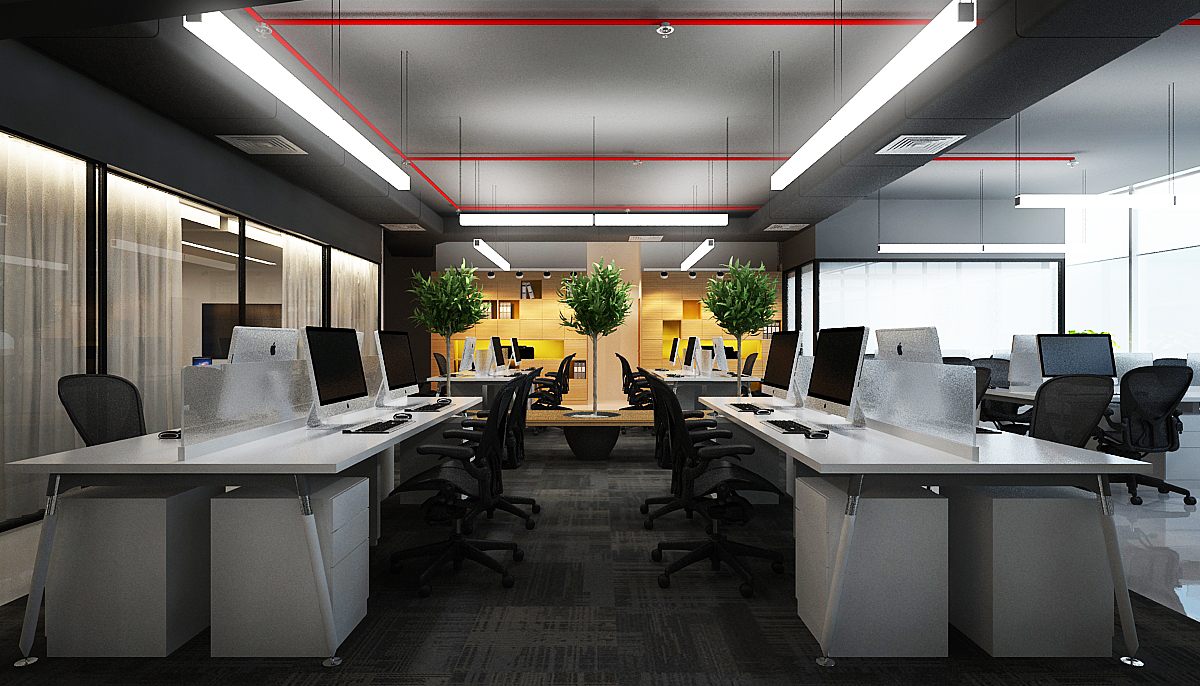 Open-plan workstation bays with white benching desks, iMacs and potted trees under red-accented linear lighting.
