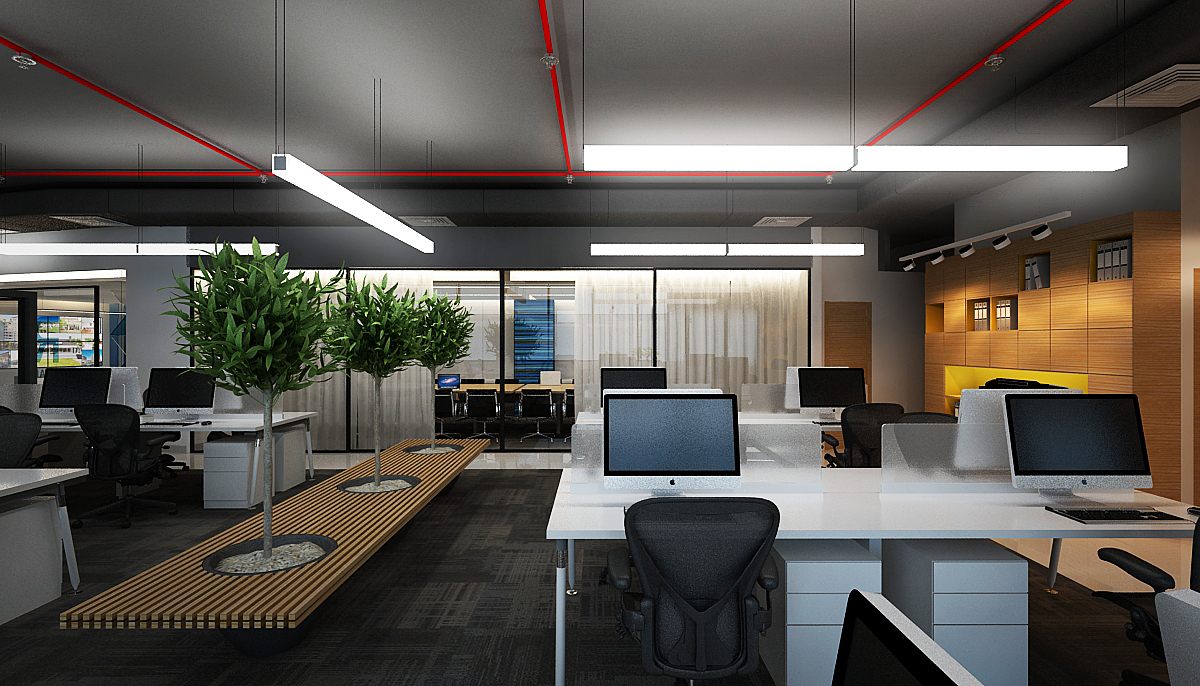 Workstation zone with planted timber benches, white desks and warm wood accent wall under red linear lighting.