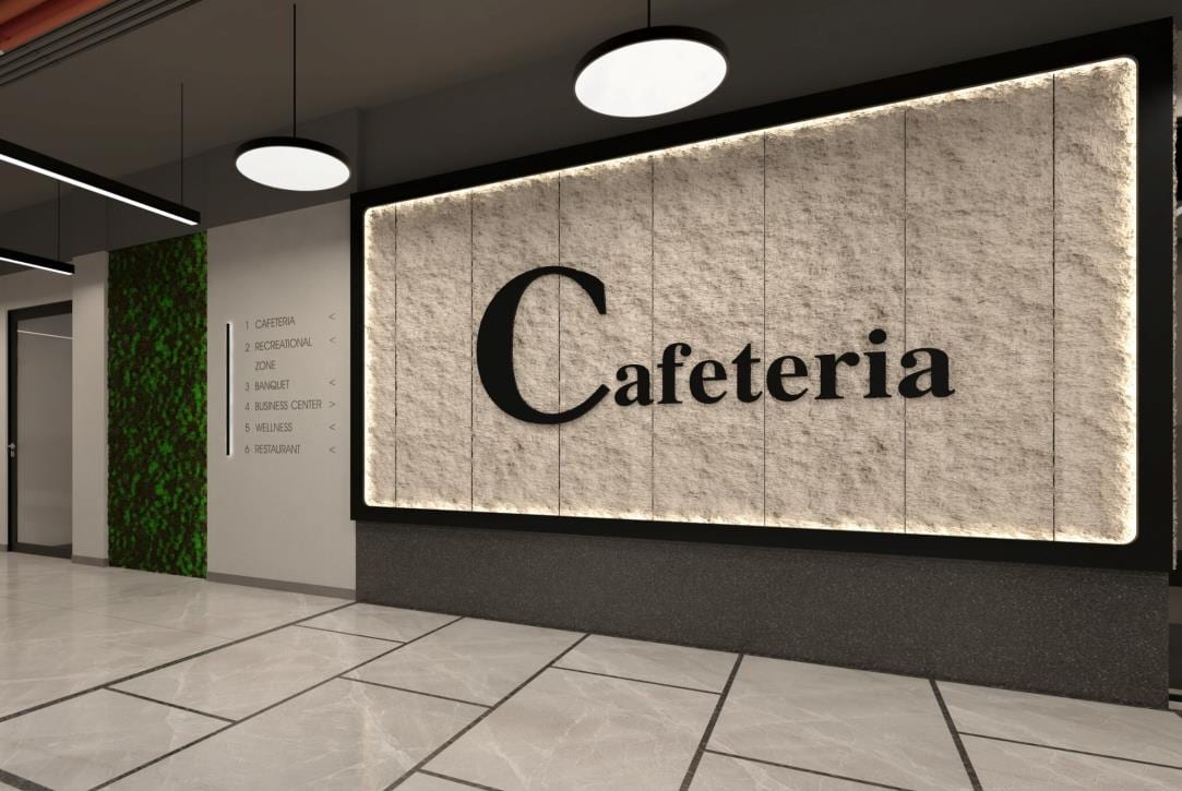 Stone-textured cafeteria feature wall beside a vertical garden under round pendant lights.