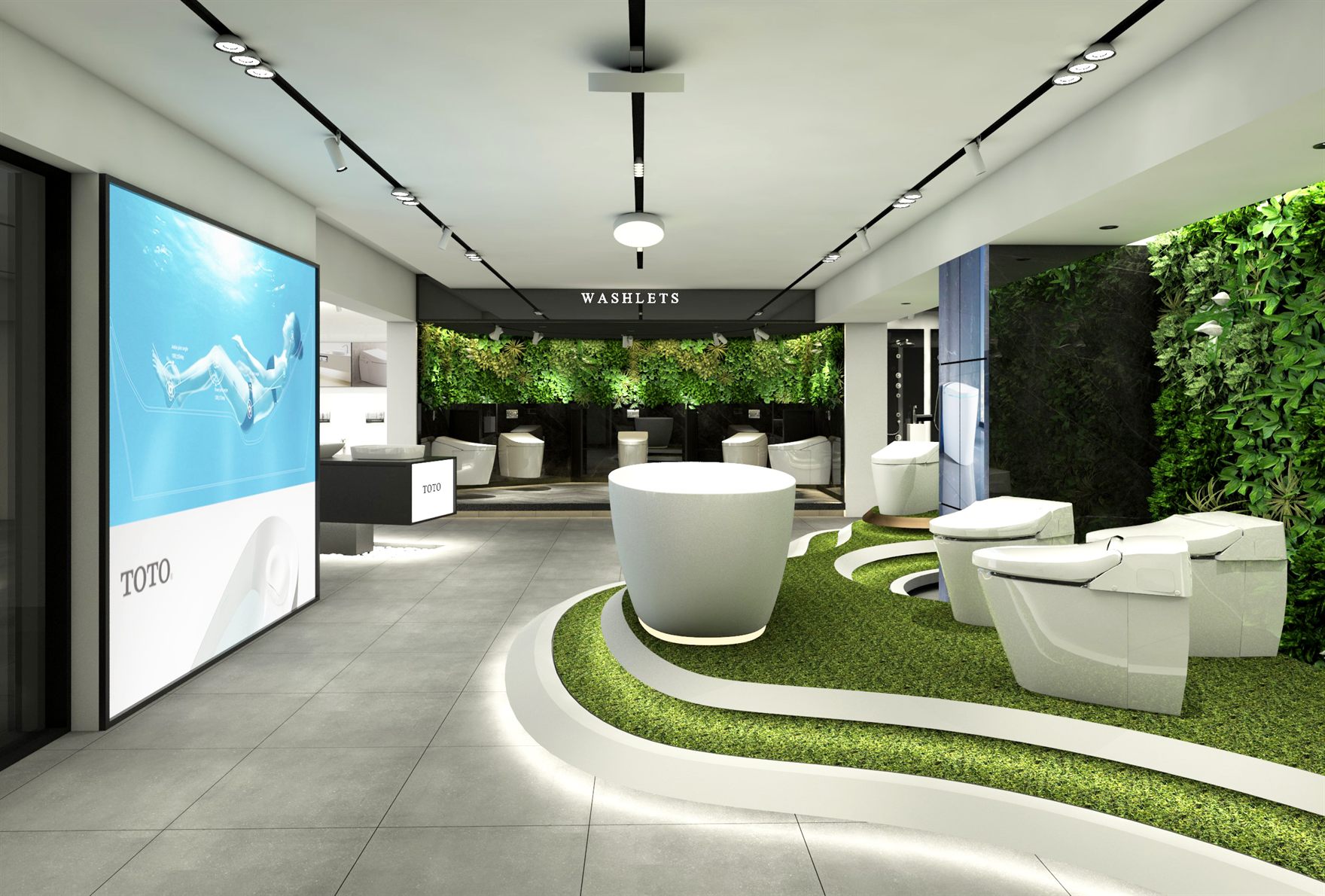 Wide showroom view with back-lit TOTO poster, curved grass mound seating and smart toilets beside a green wall under the WASHLETS sign