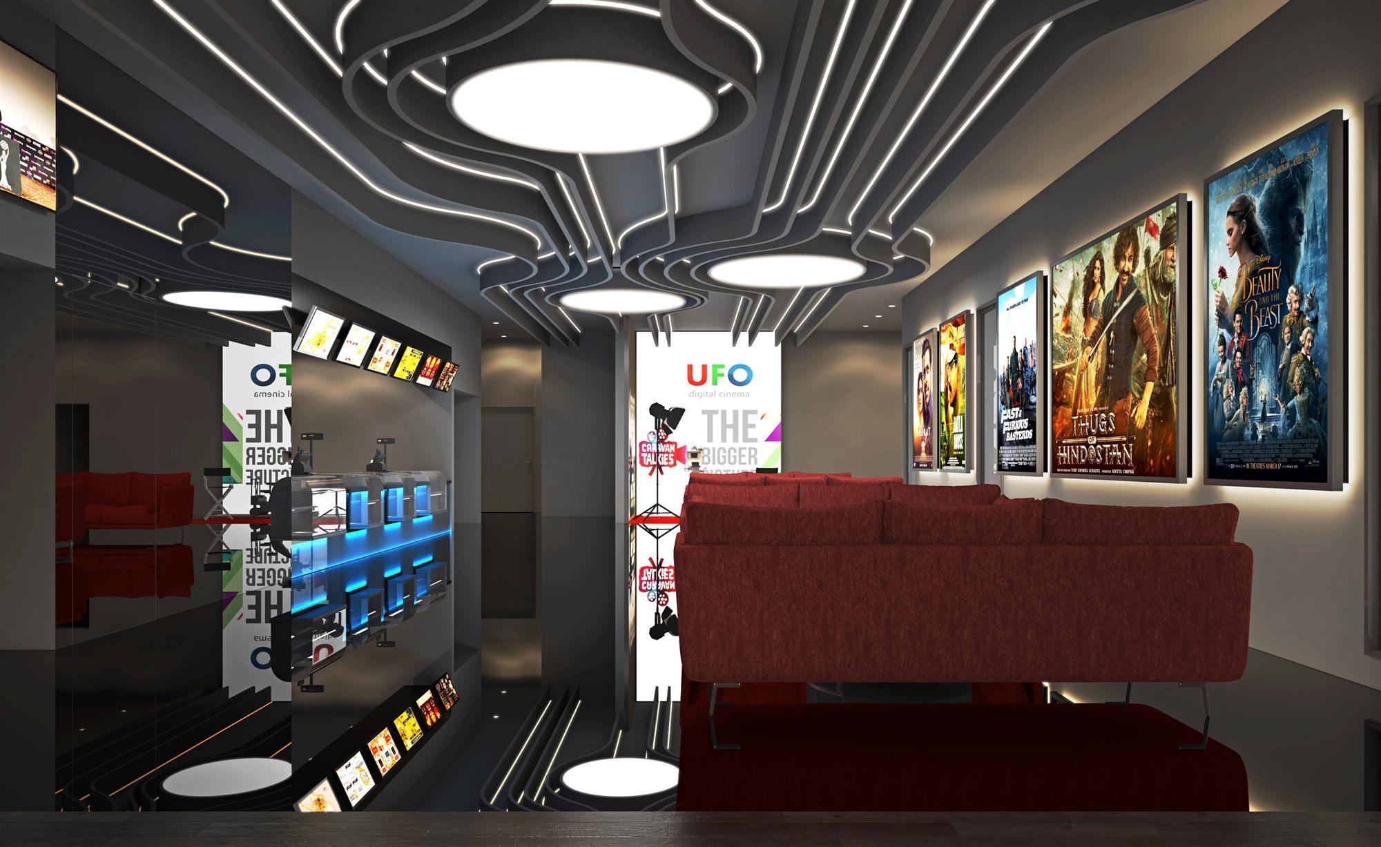 UFO-branded foyer with backlit film posters, illuminated ceiling rings, red lounge seating and a glowing concession display.