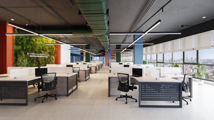 Open-plan workfloor with linear pendant lighting, exposed services ceiling, green living wall and panoramic city-view glazing.