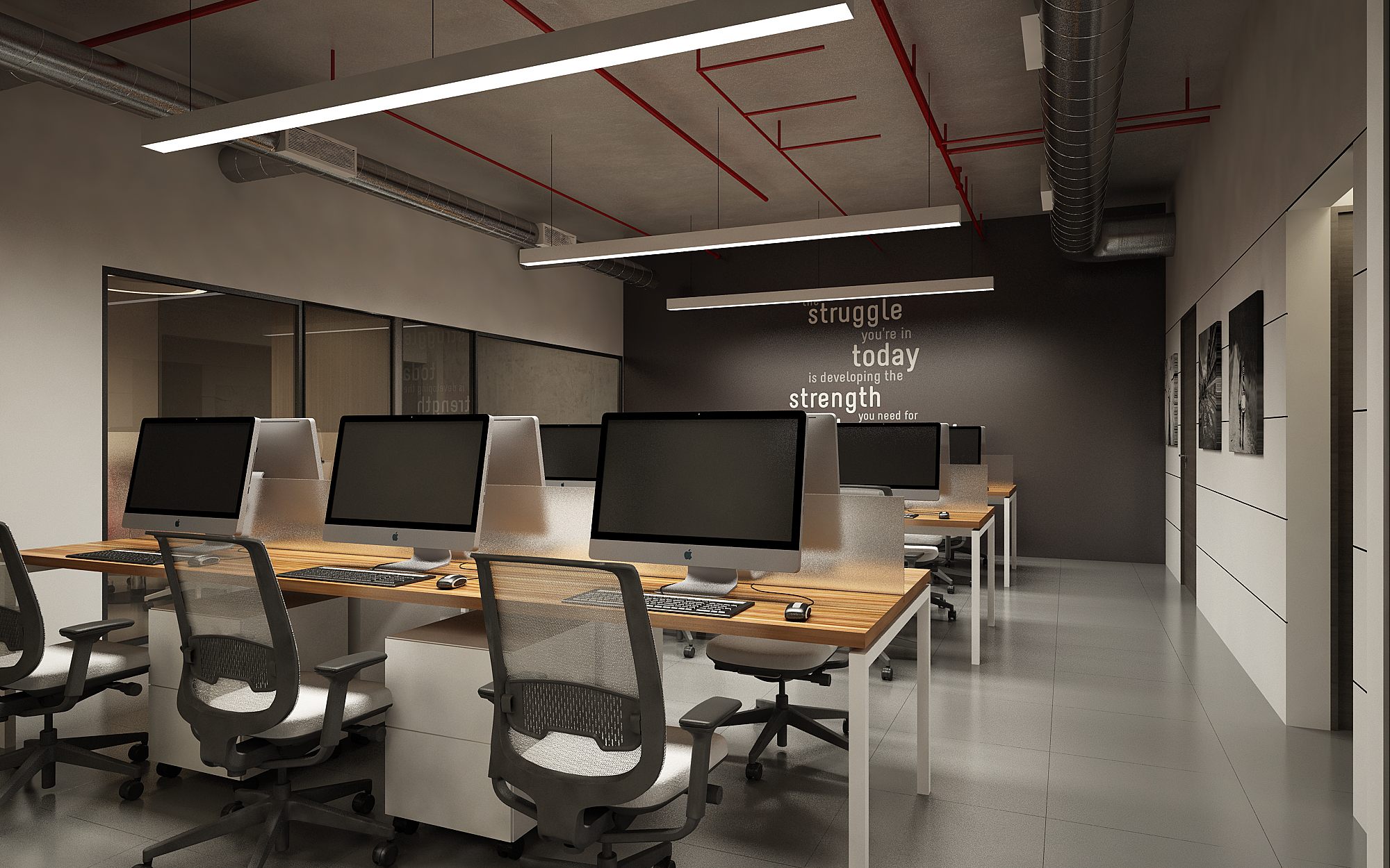 Open-plan workstation floor with iMac desks, exposed red-conduit ceiling and a 'struggle today' motivational graphic wall.